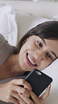 Happy, typing and woman with phone in bed for communication, online dating and internet. Morning, home and person on smartphone with smile for message, chat and social media in bedroom on weekend