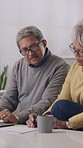 Old couple, laptop and documents for finance in home with notes, glasses or review for tax compliance. Elderly man, woman and partner on sofa with computer, writing and admin for retirement income