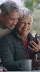 Funny, smartphone and old couple in garden, relax and digital app for social media, coffee and smile. Outdoor, pensioner and senior man with woman, cellphone and internet for comedy video and love