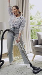 Woman, vacuum cleaner and happy with singing in home for dancing, fun and hygiene in living room. Person, smile and playful with appliance for dust, dirt or spring cleaning with voice at apartment