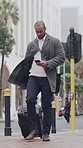 Luggage, smartphone and walking in city, man and connection for social media, location and internet. Outdoor, professional and person in street, cellphone and network for direction, suitcase and app