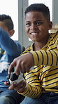 Video games, winning and children on sofa with loser for competition, esports and entertainment. Friends, home and kids with controller for gamer activity, playing together and celebrate on weekend