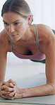 Fitness, woman and plank exercise in home for body toning, improve posture and core conditioning. Active, person and abdominal workout on mat in apartment for endurance challenge, balance and health