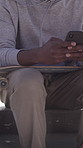 Skateboarder, man or hands outdoor with phone for text message, social media and online entertainment. Person, typing or browsing with tech, skateboard and mobile app to check skating tutorial video.