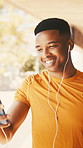 Black man, phone and video call for fitness outdoor with smile, discussion and virtual coaching. Happy, male person and earphones with mobile, live streaming and online personal trainer for wellness