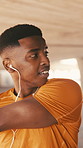 Music, runner and black man stretching in city for fitness, health and workout preparation. Start training, warm up and person with earphones outdoor for jog, wellness and getting ready for exercise