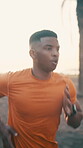 Sports, running and black man outdoor in city for health, exercise or wellness by sunset. Fitness, athlete and African male person in urban town with cardio workout, active or training in evening.