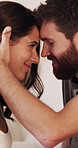 Happy, forehead touch and couple in home with love, bonding or marriage with date together. Smile, care and man with woman for connection with trust, security or romance in relationship at house.