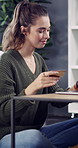 Laptop, credit card and woman on sofa in home with online shopping, ecommerce or internet banking. Coffee, debit and female person with computer for paying bills or website purchase in living room.