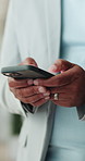 Phone, typing and hands of businessman in office with email for contact on finance negotiation. Tech, professional and financial manager with cellphone for communication on app for investment deal