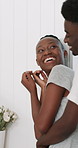 Happy, couple and hug in bathroom, love and bonding with partner in apartment, grooming and skincare. Woman, self care and laughing at joke, home and black people with smile for romance or embrace