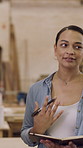 Woman, carpenter and talk with notebook in workshop for planning, design ideas and craftsmanship. Manager, pitch and discussion for client consultation, manufacturing notes and furniture production