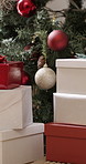 Christmas tree, present and boxes in home for celebration, sharing and kindness for festive holiday. Interior design, package and gift for xmas, tradition and decoration in living room at apartment