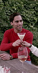 Garden, Christmas and friends with alcohol for lunch in holiday, festive season and celebrate together. December, bonding and happy people with drinks for xmas party, dinner and tradition in backyard