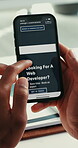 Hands, person and research with phone screen in office for developer consultation. Employee, mobile and scroll on website for software development, online inquiry and booking information for services