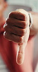 Hand, reject and thumbs down with business man in office for failure or negative feedback. Emoji, mistake and review with design employee in creative workplace for bankruptcy or retrenchment