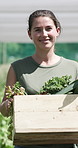 Happy, farmer and woman with vegetables, outdoor and walking with harvest in nature and agriculture. Farm, sustainability and person with smile for crops, fresh produce and healthy food production