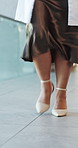 Doctor, legs and woman in hospital, walking to appointment and healthcare worker with lab coat. Shoes, physician and person in clinic, high heels and medical service for wellness, cardiology or steps