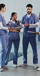 Doctor, tablet and people in hospital, teamwork or digital app for surgery schedule. Employees, help or physician in clinic, meeting or tech with support, conversation or medical service with interns