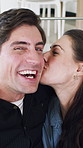 Happy couple, selfie and face with kiss in house with bonding, connection and laugh with post on web. Man, woman and smile with partner, photography or portrait for social media at apartment in Spain
