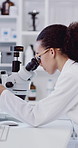 Woman, scientist and microscope with forensic research in laboratory for medical study or results. Female person, doctor or biologist with biotechnology or science for test, exam or clinical trial