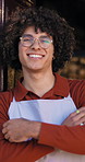 Face, man and barista with arms crossed at cafe for welcome, friendly waiter and customer service. Portrait, person and confident at front door, proud employee and hospitality industry at restaurant