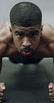 Plank, face and man in gym for exercise, routine and improve posture with workout and health goals. Bodybuilder, wellness and African person with balance for metabolism, core fitness and strength