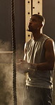 Fitness, powder and rope climbing with black man in gym for challenge, performance or strength. Chalk, exercise and training with athlete or climber in health club for bodybuilding and workout
