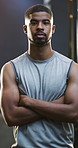 Crossed arms, fitness and face of man in gym with confidence for workout, active or training. Serious, athlete and portrait of male person with pride for exercise, wellness or health in sports center