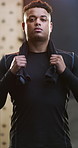 Towel, fitness and face of man in gym with confidence for workout, active or training. Serious, portrait and male person with pride for exercise, wellness or health at sports center in Brazil.