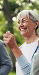Fitness, happy or old woman in park with class, cardio exercise or workout in wellness hobby together. Smile, senior people or coach with bokeh, walking activity or group training in retirement.