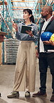 Logistics, meeting and woman with tablet, warehouse or discussion with colleagues for stock delivery. People, talking and project manager with tech for goods distribution and supply chain in factory