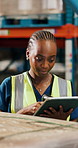 Tablet, black woman and logistics worker with scanner in warehouse for checking packages for shipping. Digital technology, quality assurance and female supply chain employee with stock management.
