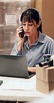Woman, laptop and phone call at warehouse for logistics with shipping, inventory management or report. Mature person, tech and decision for storage, schedule and supply chain with quality control