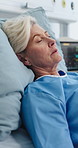 Senior woman, sleeping and sick in hospital bed with rest, recovery and monitor for heart rate. Elderly person, exhausted and rehabilitation for healing, illness and healthcare services in retirement