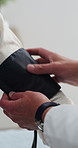 Blood pressure, check up and hands with doctor in clinic for medical exam, support and consulting. Healthcare, hospital and person with equipment for heart rate, monitor wellness and hypertension