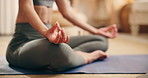 Balance, hands and meditation with woman in living room of home for inner peace or zen exercise. Breathing, mudra and yoga with calm person on floor of apartment for holistic wellness or mindfulness