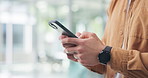 Man, hands and typing in office with phone, text message and search trend for social media marketing. Person, tech and browse in workplace with online chat, mobile app and idea for digital branding.
