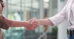 Business women, meeting or greeting with handshake for partnership, introduction or deal in office. Female people, employees or colleagues shaking hands for b2b, agreement or teamwork in workplace