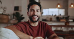 Break, face and smile of man on sofa in living room of home for me time or satisfaction. Peaceful, relax and weekend with happy Indian person in apartment for chilling, rest or wellness pause