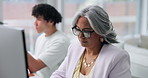 Computer, thinking and mature businesswoman in office with research for creative project. Technology, planning and female magazine director with ideas for article with publishing in workplace.