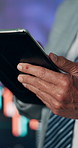 Business person, hands and tablet with stock market research for online finance or investment. Closeup, broker or trader scrolling with technology for digital curreny or asset management in workplace