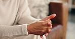 Thinking, anxiety and hands of woman on sofa with worry for decision, stimming and overthinking in home. House, lounge and person with anxious, nervous and unsure of future, mental health and stress