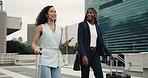 Happy women, business travel and walking with suitcase in city for work trip or commute together. Female people, employee or colleagues with smile, tablet or luggage for new career or job opportunity
