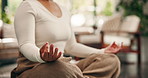 Hands, yoga and lotus on floor at apartment for mindfulness, breathing exercise and wellness in lounge. Person, meditation and mudra with holistic health, balance and post in living room at house