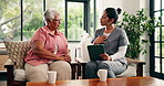 Discussion, tablet and old woman with caregiver on sofa, health assessment survey and medical checkup. Elderly care, wellness evaluation or senior person with nurse in home, explain symptoms and tech