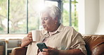 Blow coffee, phone and senior woman in home for relax, morning news and retirement on sofa. Hot tea, mobile and elderly person with smile, online communication or reading article in living room