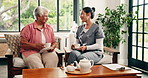 Coffee, conversation and nurse with senior woman in home for consultation, bonding or support. Happy, tea and healthcare worker with elderly patient for drinking warm beverage at medical checkup.