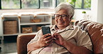 Funny, phone and senior woman in home for relax, comedy post or scroll in retirement on sofa. Laugh, smile or elderly person with mobile for joke, online communication or reading meme on social media