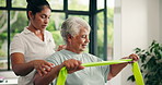 Senior woman, physiotherapist and resistance band at clinic for recovery, stretching and muscle wellness. People, smile and helping hand with rehabilitation for injury, support and talk in retirement